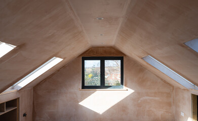 Brown plastered walls in the property, preparation for the paint. Loft conversion with straight...