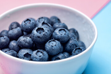Blueberry fruit macro with dew drops background. 