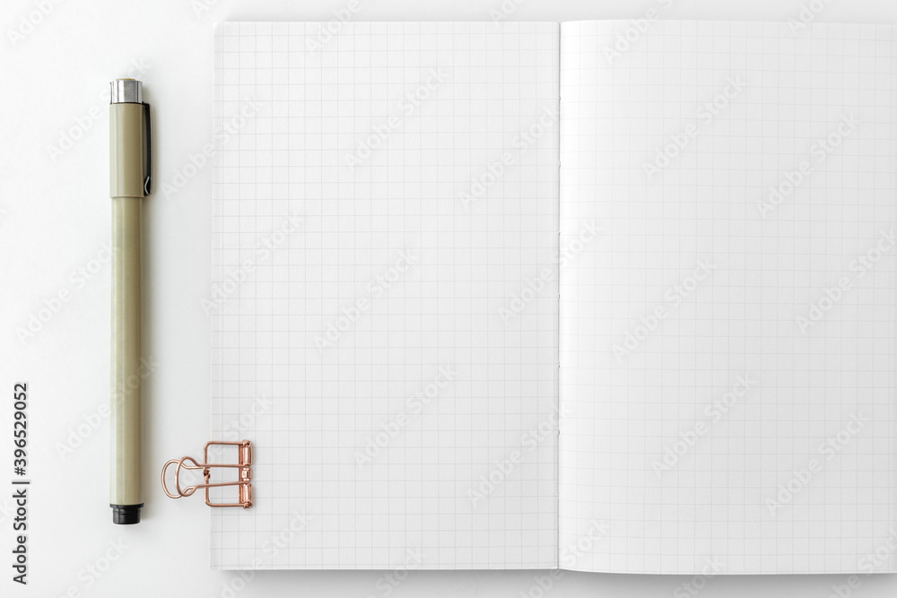 Poster blank grid patterned notebook page with stationary