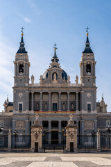 Fototapeta na wymiar Beautiful view of Cathedral of La Almudena in Madrid on bright blue sky