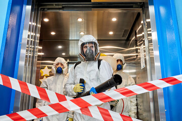 disinfection and decontamination in a public place, COVID-19 concept. state of emergency over...