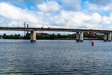 Russia, Kostroma, July 2020 . Fragment of a large concrete bridge over the river.
