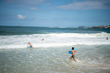   Citizens swim on the beach of Copacabana
