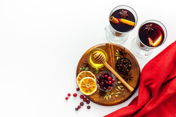 Mulled wine background. A hot winter Christmas drink based on red wine, spices and citrus fruits.
