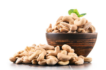 Bowl with cashew nuts isolated on white