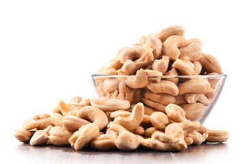 Bowl with cashew nuts isolated on white