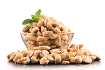 Fototapeta premium Bowl with cashew nuts isolated on white