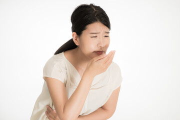 Fototapeta premium 吐き気に悩む日本人の若い女性