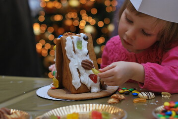 child making Gingerbread house