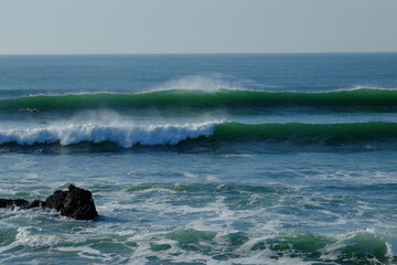 Some surfers in november in the west of France.