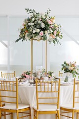 Table setting and decoration with flowers for a ceremony or celebration.	
