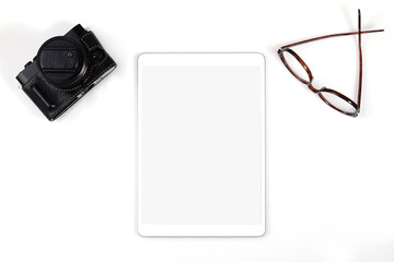 Top view a blank screen tablet computer against a white background