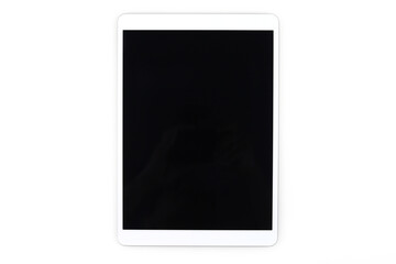 Top view a blank screen tablet computer against a white background