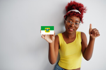 Brazilian woman with afro hair hold Rio Grande do Norte flag isolated on white background, show thumb up. States of Brazil concept.