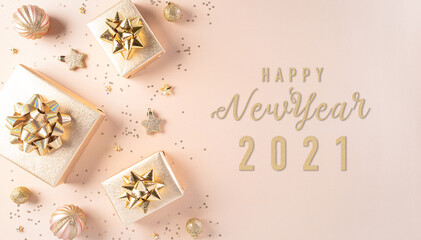 Fototapeta na wymiar Merry Christmas and New year celebration concept. Golden gift box, stars and christmas ball on pastel background. Flat lay, top view happy new year text.