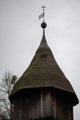 old wooden church tower with cross