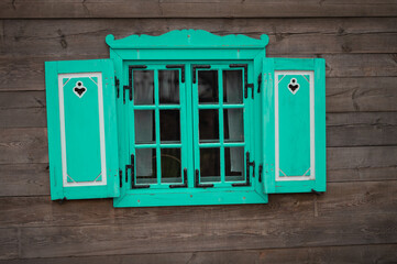 Naklejka na ściany i meble old colored window with shutter