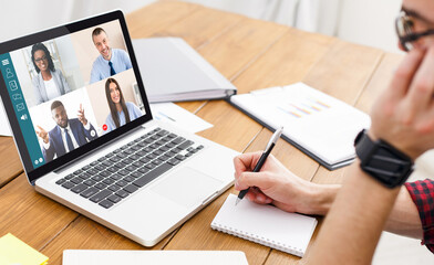 Fototapeta na wymiar Man having video conference with team while working from home