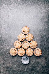 Fototapeta na wymiar Mince pies, traditional christmas food from all butter shortcrust pastry filled with cranberries, sultanas, currants, raisins, along with festive spices, clementine juice, dash of brandy and cognac