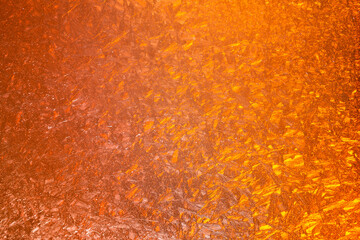 abstract orange background. colored frost on the window. texture