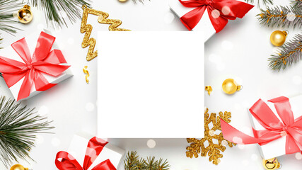 Christmas decoration isolated. White gifts with red bow, golden balls and Christmas tree in xmas decoration on white background for greeting card. Decoration and copy space for your text.