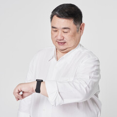 Plus size men's white shirt with hand watch fashion shoot in studio