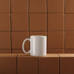 white mug among cardboard boxes.