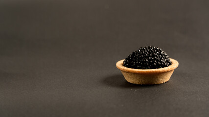 
black caviar on a black background
