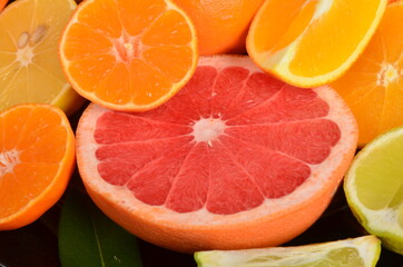 Fototapeta na wymiar Close-up of sliced citrus fruits, Various citrus fruits, Citrus background