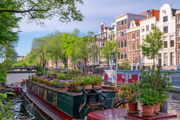 Typical buildings and canal in Amsterdam by day, Netherlands