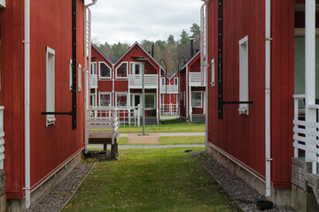 Typical Scandinavian wooden cottages painted with red paint