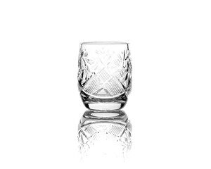 Crystal empty glass vodka shot glass isolated on white background with reflection