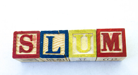 The word slum visually displayed on a clear background image with copy space