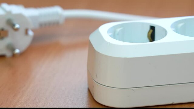 Cut off the electricity supply. Disconnect from electricity. Pulls out the power cable from the socket. Pulling cable out of socket and turning soket off