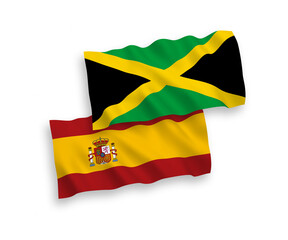 National vector fabric wave flags of Jamaica and Spain isolated on white background. 1 to 2 proportion.