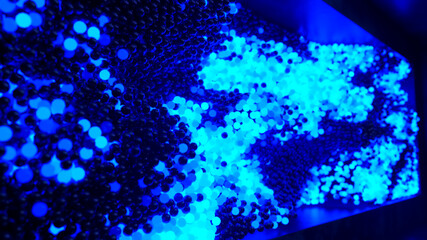 Obraz na płótnie Canvas Abstract cloud of randomly glowing blue spheres in a futuristic room. Conceptual technology business composition. 3d illustration