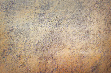 Gold background. Against the background of the wall, the plaster of the bark beetle is painted golden. Grunge photo concept. Gloomy, dark background, brick, paint, artistic, design, pattern