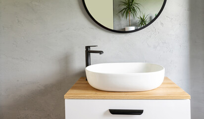 Bathroom interior  with grey wall, stylish sink bowl and tap. Minimalism in interior of bathroom....