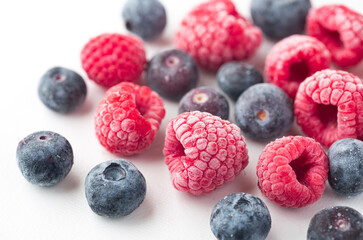 Close-up of fresh frozen raspberries and blueberries