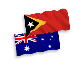 National vector fabric wave flags of Australia and East Timor isolated on white background. 1 to 2 proportion.