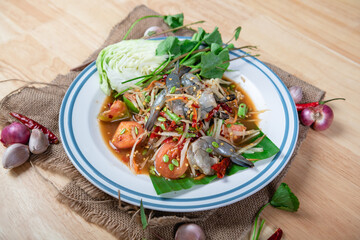 Fresh shrimp green papaya salad.Thai Style spicy seafood salad with shrimps isolated on the white background with clipping path.
