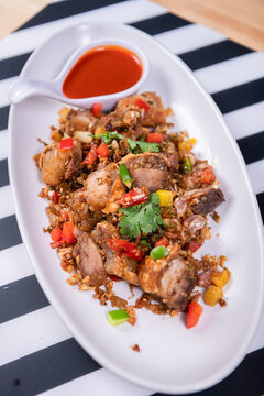 Fried Crispy Pork  On a white plate- Thai food style
