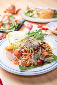 Fresh shrimp green papaya salad.Thai Style spicy seafood salad with shrimps isolated on the white background with clipping path.
