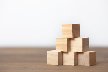 Stacking wooden block as step ladder. Business concept for growth success process.
