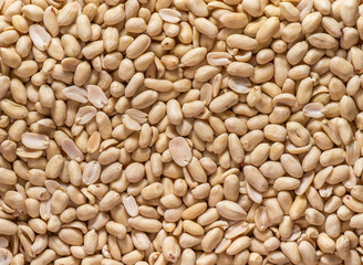 Background of peeled peanuts close-up without free space.