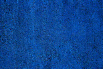 Blue colored abstract wall background with textures of different shades of blue