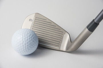 golf club and ball on white background