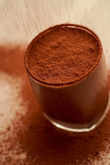 Chocolate dessert and pouring cocoa powder 