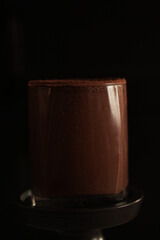 Chocolate dessert with the lights  on a black background