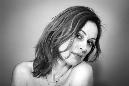 Mature, pretty woman over forty, black and white natural portrait. 
